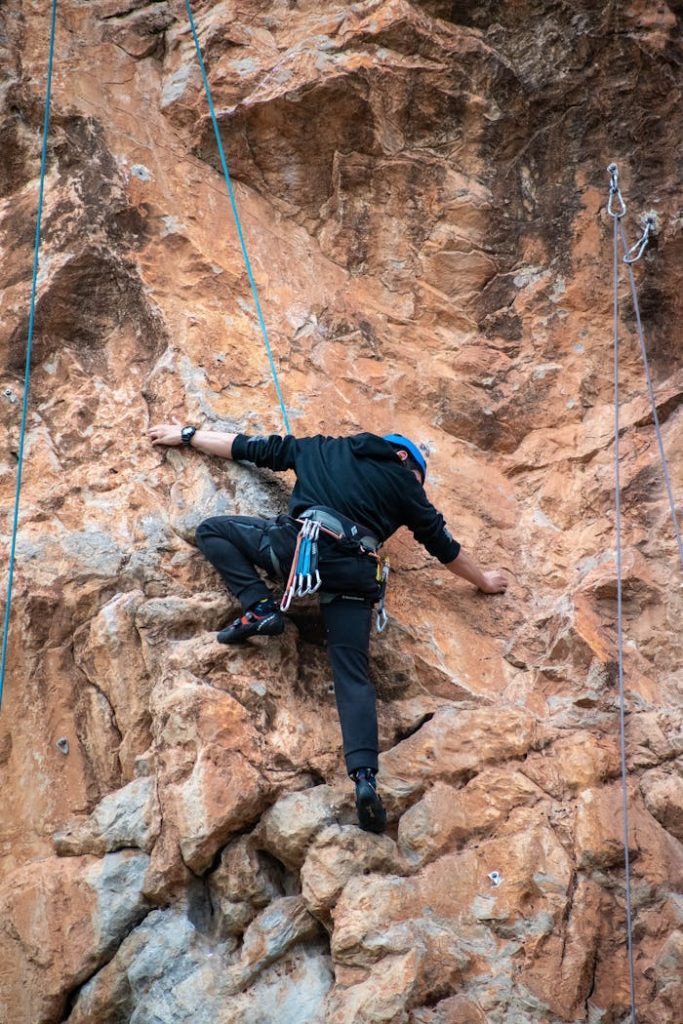 pexels photo 15743420 Man engaged in rock climbing on rugged cliff in Kaiafas, Greece, showing adventure and determination.
